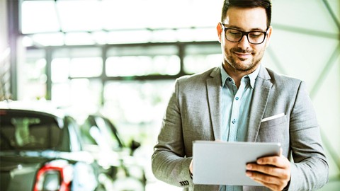 A man smiling and looking at a paper. Automobile Management